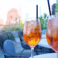 © goodluz | stock.adobe.com | (View of cocktail glasses set on rooftop table)